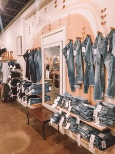 a clothing store filled with lots of blue jeans