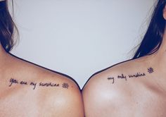 two women with tattoos that say you are my sunshine and my happiness on their chests