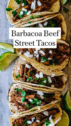 four shredded beef tacos with limes and cilantro