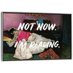 a woman laying on top of a bed with the words not now, i'm reading