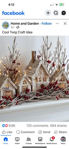 a fake christmas village is displayed on the fireplace mantel, with lights and decorations