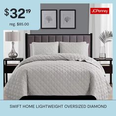 a bed with white comforter and pillows on it for $ 32 99 reg $ 65 00