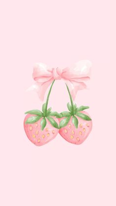 two strawberries with pink bows hanging from them