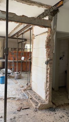 the interior of a house being remodeled with exposed walls and floor joists in place