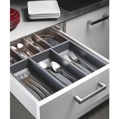 an open drawer with silverware in it