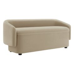 a beige couch sitting on top of a white floor