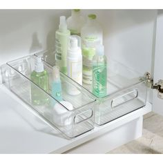 an organized bathroom drawer with soap, lotion and hand sanitizers on it