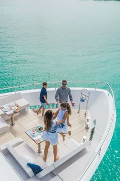 two children and an adult on a boat in the water