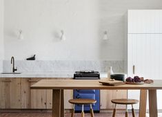 the kitchen is clean and ready to be used as a dining room or office space