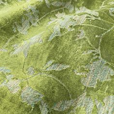 close up view of green fabric with floral design