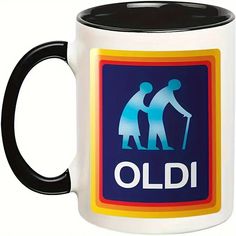 a black and white coffee mug with an oldi sticker on the side,