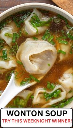 a bowl of wonton soup on a wooden table