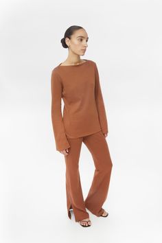 The Wool Blend Boatneck Sweater - experience comfort. This boatneck sweater showcases an elegant neckline and a slight A-line shape to flatter the torso. - A luxurious Chobitto wool blend - our wool boatneck sweater offers a cozy and soft feel for a lifetime. - Contemporary touches - with draping, long split sleeves at the cuff, this knitted staple has been made with the modern woman in mind. Pair the The Wool Blend Boatneck Sweater with our Wool Blend Knit Pants. Size fit • Relaxed, comfortable Split Sweater, Boatneck Sweater, Brown Sweater, Knit Pants, Women Pullover, Boat Neck, Modern Woman, The Modern, Wool Blend