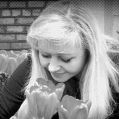 black and white photograph of a woman holding flowers