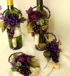 three wine bottles decorated with flowers and corks