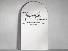 an arch shaped mirror with the words our favorite people written on it in black ink