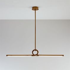 a modern light fixture hanging from the ceiling