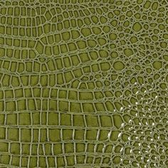 an alligator skin pattern in green with white highlights on the top and bottom half of it