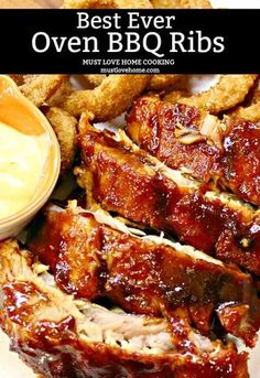 bbq baby back ribs on a plate with dipping sauce