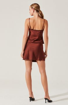 Satin lace trim mini skirt Mini bow detail at center front waist hem Concealed zipper at side seam with hook & eye closure 100% Polyester Exclusive of Trim Dry clean only Style #AS9211 Satin Camisole, Trim Styles, Mini Bow, Lace Trim Top, Astr The Label, Mini Bows, Trim Top, Skirt Mini, Scalloped Lace