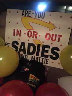 there is a sign that says in or out sadies you'll mattie