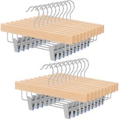 two wooden hangers with metal clips attached to the sides of each hanger are shown in three different positions