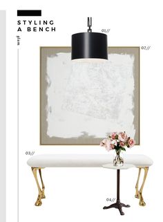 a white bench sitting under a black lamp next to a table with flowers on it