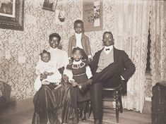 an old black and white photo of a family