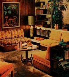 a living room filled with furniture and bookshelves next to a lamp on a table