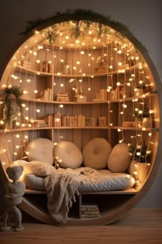 a circular bed with lots of lights on it's headboard and bookshelf