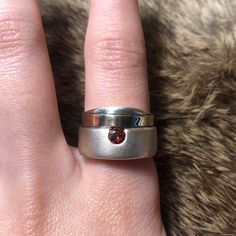 Vintage Flli Menegatti? sterling silver and 14k minimalist garnet ring. Chunky matte sterling ring with band of 14k gold and deep red faceted garnet. Stamped 925 585 (14k), signed VI, size 8, 8.71g. Modern Sterling Silver Birthstone Ring For Everyday, Modern Garnet Jewelry For Anniversary, Modern Sterling Silver Ruby Ring For Anniversary, Modern Garnet Rings For Anniversary, Modern Garnet Jewelry, Formal Stackable Ruby Ring In Sterling Silver, Sterling Silver Rings With Tension Setting For Everyday, Modern Silver Ruby Ring With Polished Finish, Minimalist Silver Ruby Gemstone Ring