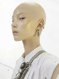 a mannequin head with earrings on it