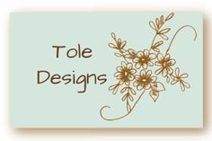 the words toe designs are written in brown on a light blue background with small flowers