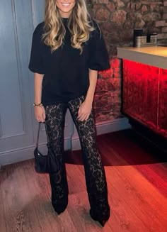 Lace Palazzo Pants Outfit, Lace Skirt Casual Outfit, Xmas Night Out Outfit, Lace New Years Outfit, Black Flare Pants Outfit Midsize, Lace See Threw Top Outfit, Celebrity Going Out Outfits, Lace Flares Outfit, Christmas Outfit Black Pants