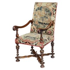 an ornately decorated chair with wooden legs and arm rests against a white background,