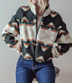 Stay warm and stylish this winter with our Aztec tribal print Cropped sherpa jacket. The soft and warm teddy fabric makes it perfect for chilly days, while the Aztec tribal print adds a trendy and unique touch. The short length and zip-up front make it easy to layer over your favorite outfits, and the hidden side pockets add convenience and functionality. This jacket is not only fashionable but also incredibly cozy, providing you with both style and comfort during the colder months. Small (2/4), Multicolor Fair Isle Pattern Outerwear For Fall, Multicolor Fair Isle Outerwear For Fall, Multicolor Warm Outerwear For Fall, Warm Multicolor Outerwear For Fall, Nordic Black Outerwear For Fall, Multicolor Long Sleeve Outerwear With Fair Isle Pattern, Warm Cozy Multicolor Outerwear, Cozy Fair Isle Pattern Outerwear For Fall, Cozy Fair Isle Outerwear For Fall