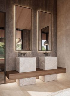 two sinks and mirrors in a modern bathroom