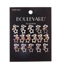 eight pairs of earrings with charms in the shape of dogs and stars on them, each featuring