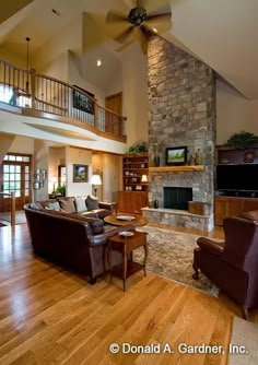 a living room filled with furniture and a fire place