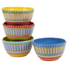 four bowls are stacked on top of each other in different colors and designs, with one bowl