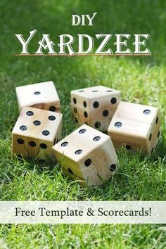 four wooden dices sitting in the grass with text overlay that says diy yardze