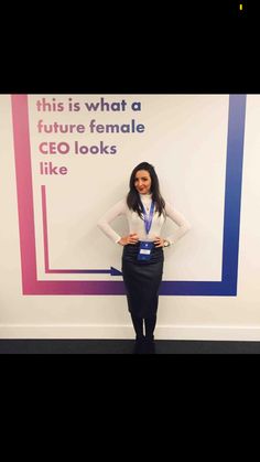 a woman standing in front of a sign that says this is what a future female ceo looks like