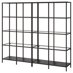 a black shelf unit with glass shelves on each side and metal bars at the bottom