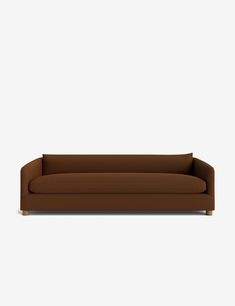 a brown couch sitting on top of a white floor