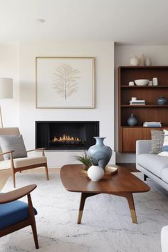 a living room filled with furniture and a fire place in the middle of the room