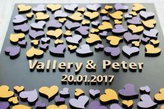 a sign with hearts on it that says valley & peter 2010 - 2017 in gold and purple