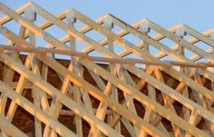 a wooden structure that is being constructed with wood planks