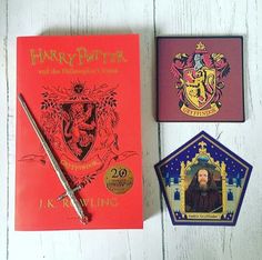 harry potter and hermione's school book with pen, badge and pin