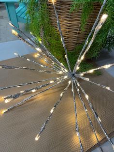 a large metal object with lights on it's sides sitting on top of a table