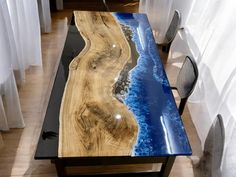 a table that has been made to look like an ocean wave on the side of it